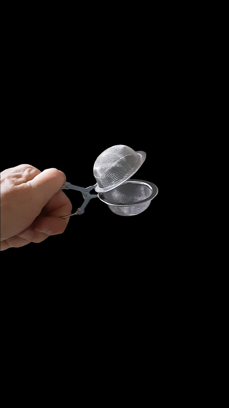 Préparation de thé ou tisane : Pince à thé